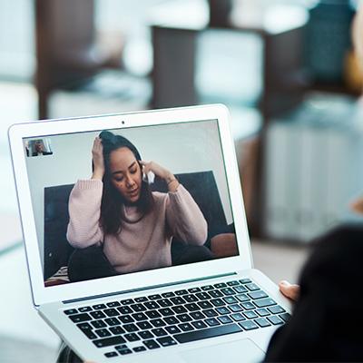 a person on a laptop screen